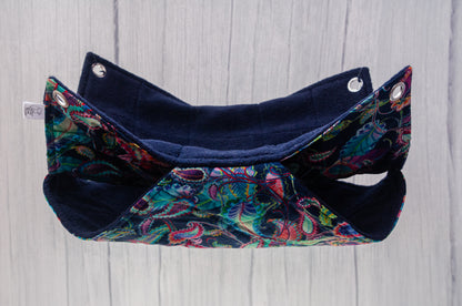 Double rat hammock suspended in air, navy paisley pattern on fabric with 10mm eyelets in each corner