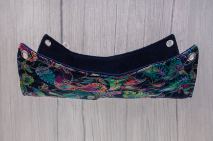 Flat rat hammock suspended in air, navy paisley pattern on fabric with 10mm eyelets in each corner