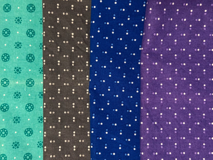 flat lay image of fabrics with dots, top aqua, next grey, next blue and bottom purple