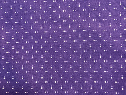 Purple fabric with white polka dot pattern