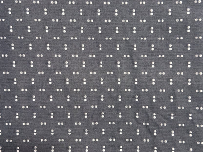 Gray fabric with a small white dot pattern