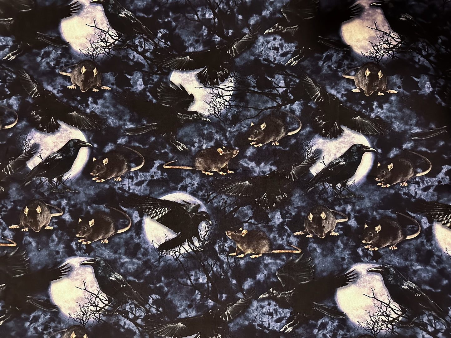 Photo of fabric - rats, crows, trees and the moon.