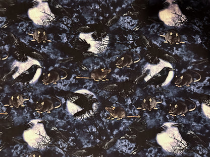 Photo of fabric - rats, crows, trees and the moon.