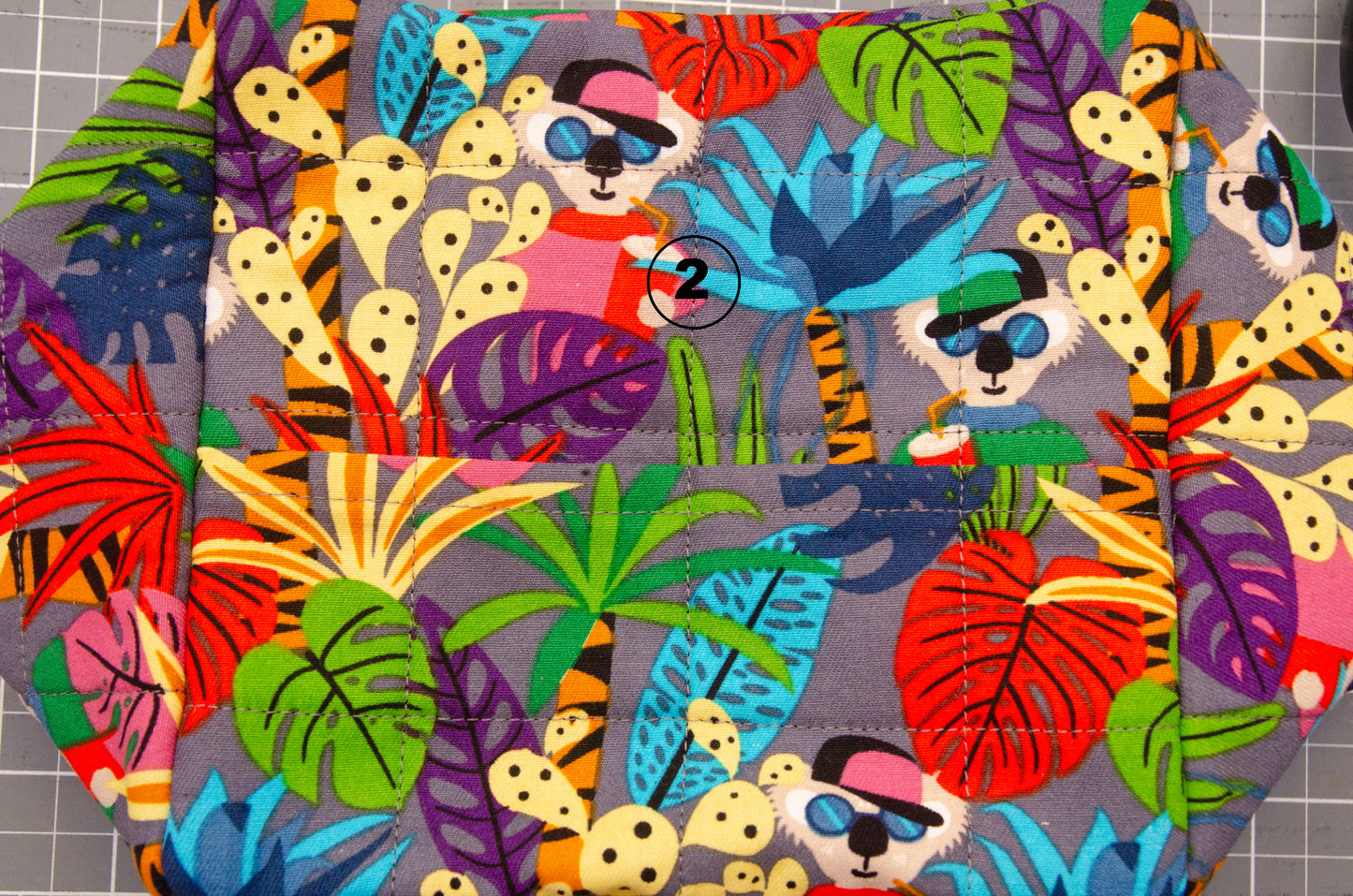 Flat lay cube hammock with koala fabric showing extra seam on bottom.